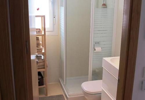 a bathroom with a shower and a toilet and a sink at Casa la Vida - Golf villa with private pool in Alhama de Murcia