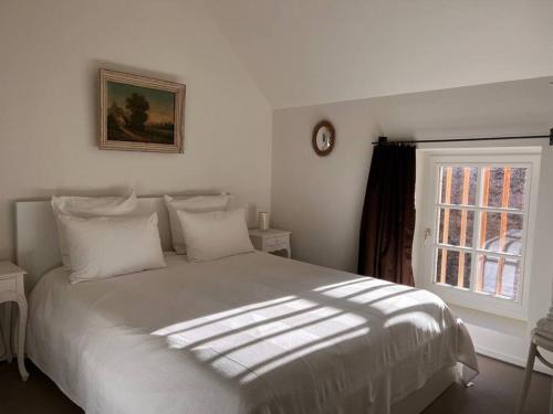 Säng eller sängar i ett rum på Les Granges du Barri-haut