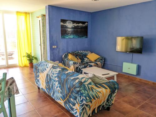 Postel nebo postele na pokoji v ubytování Blue Wave House Corralejo