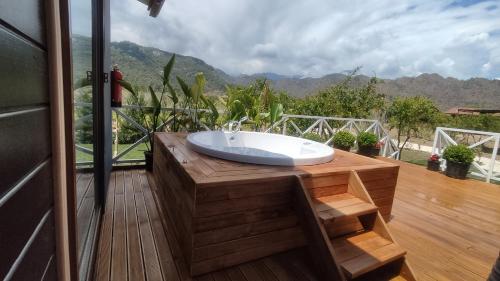 a bathroom with a bath tub on a deck at Villa Nar in Cıralı