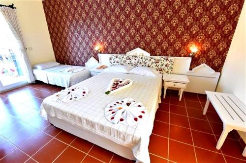 Cama o camas de una habitación en Artemisia Royal Park Club Hotel