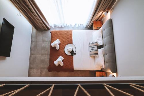 a hotel room with a table and chairs at Sithon Diamond Suites 1 in Nikiti