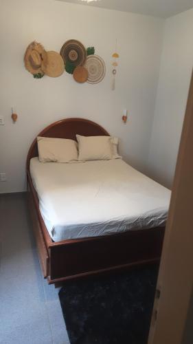Ένα ή περισσότερα κρεβάτια σε δωμάτιο στο Residencial Thermas Rio Caldas
