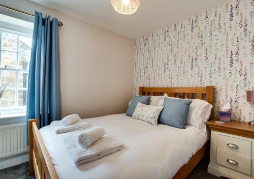 Un pat sau paturi într-o cameră la Badgers Rest