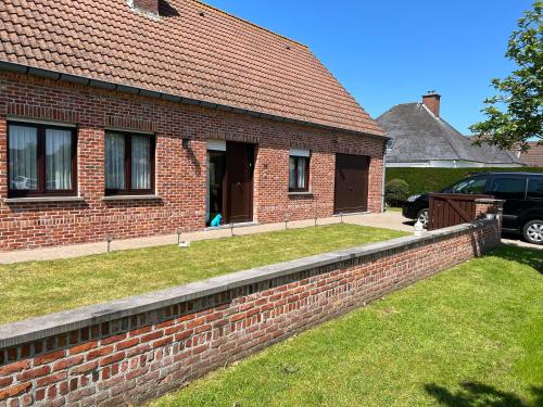 a brick retaining wall in front of a house at Villa Jean in Blankenberge