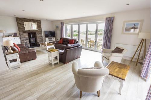 a living room with a couch and a table at The Bay Filey in Filey