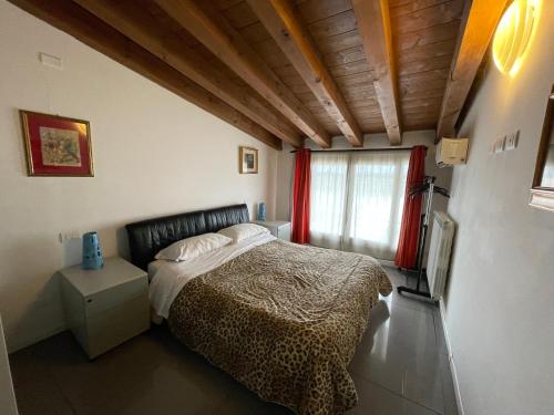 a bedroom with a bed and a window at Milano Canal Apartments in Milan