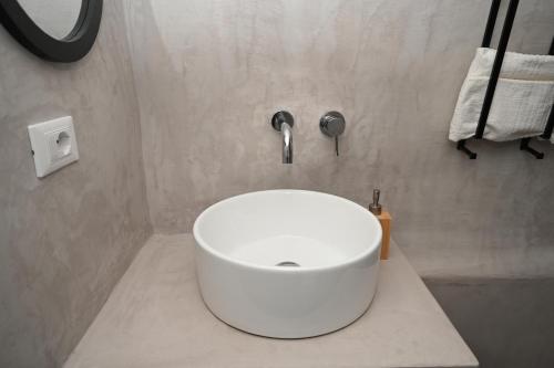 a bathroom with a white sink in a room at CASA FLAMI' 4 in Ostuni