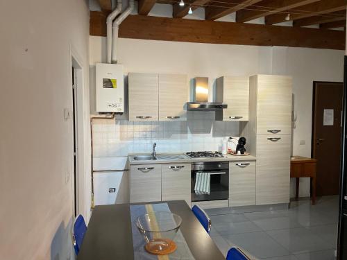 a kitchen with a table and a stove top oven at Milano Canal Apartments in Milan