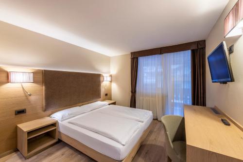 TV a/nebo společenská místnost v ubytování Design & Suite Hotel Ciarnadoi