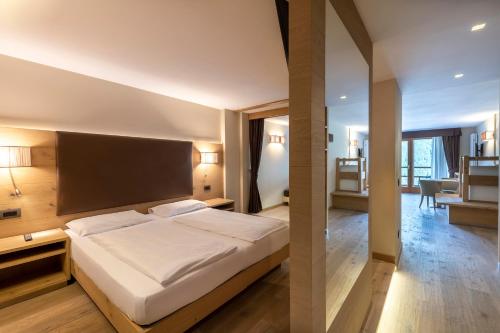Postel nebo postele na pokoji v ubytování Design & Suite Hotel Ciarnadoi