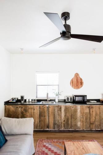 a kitchen with a wooden counter top in a room at Contigo Ranch Fredericksburg in Fredericksburg