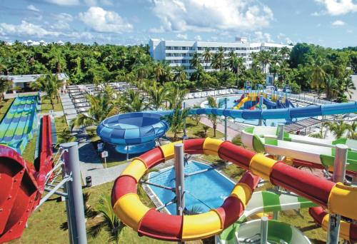 a water park at a resort with a water slide at Riu Palace Bavaro - All Inclusive in Punta Cana