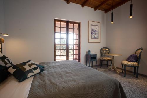 Postel nebo postele na pokoji v ubytování PHOENIX maison d'hôtes & SPA