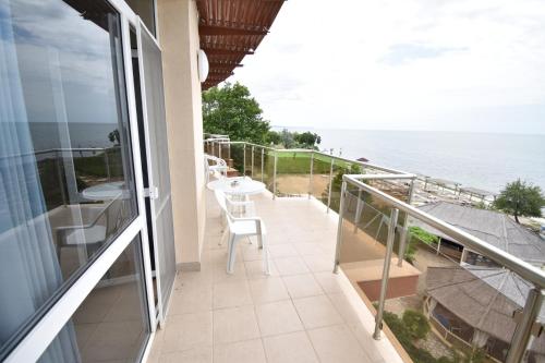 a balcony with a view of the ocean at Annabella in Topola