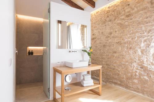 a bathroom with a sink and a mirror at Petit Palau Alcudia - Adults Only in Alcudia