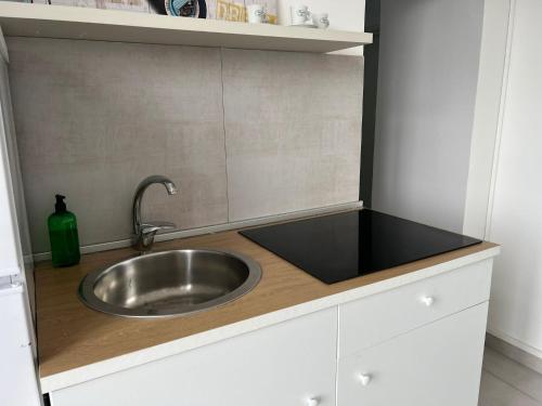 a kitchen with a sink and a counter top at SKY HOUSE LUXURY in Naples