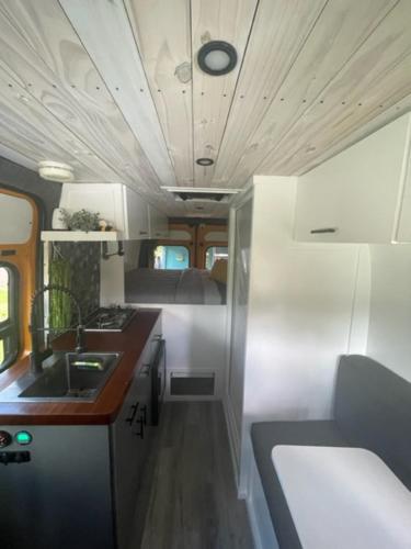 a kitchen in an rv with a sink at BeeVan in Aguadilla