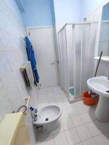 a bathroom with a shower and a toilet and a sink at Licia Comfort Zone in Sciacca