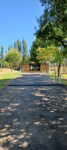 a park with a bench on the side of a road at Majuba Guest Lodge in Volksrust
