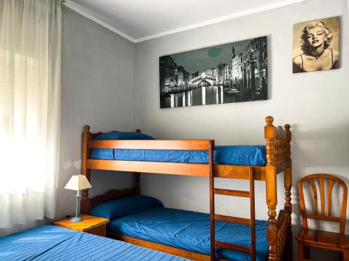 a bedroom with a bunk bed and a bunk bed at Vivalidays Casa Ricardo in Sant Cebrià de Vallalta