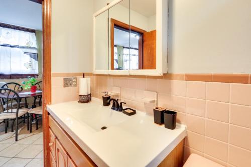 a kitchen with a sink and a table and a window at Cozy and Convenient West Orange Home - 16 Mi to NYC! in West Orange