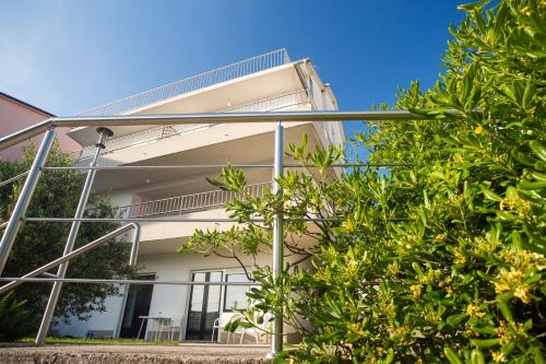 a view of a building from the street at Apartments Adriatic in Selce