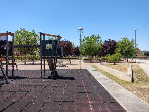 a park with a playground with a basketball hoop at Lillananna Reload in Porto SantʼElpidio