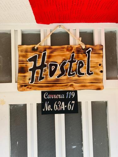 a sign for a hotel hanging on a door at Bogotá Kings 101 in Bogotá