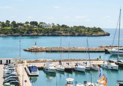 a group of boats docked in a harbor at Hotel Baluma Porto Petro in Portopetro