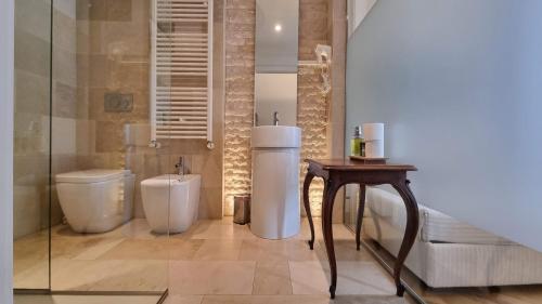 a bathroom with a toilet and a bidet at Le Saline Luxury Guest House in Trieste