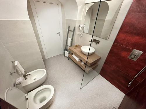 a bathroom with a toilet and a sink at Dimora dei Celestini in Manfredonia