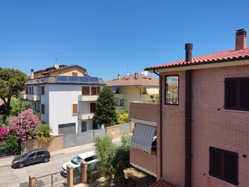 a view from the balcony of a house with a parking lot at Lillananna Reload in Porto SantʼElpidio