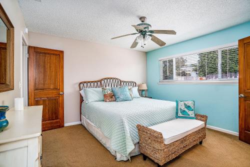 a bedroom with a bed and a ceiling fan at Verdon Oasis in Morro Bay