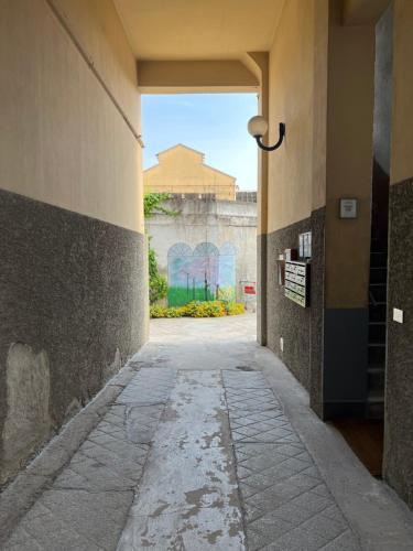 an empty hallway in a building with graffiti on the wall at Xenia Apartments - Nuovo appartamento in zona tranquilla in Milan