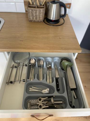 a drawer filled with cooking utensils in a kitchen at Apartment Dubnica Prejta 3 in Dubnica nad Váhom