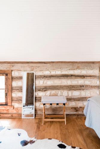 a room with a wooden wall with a bench in it at Contigo Ranch Fredericksburg in Fredericksburg