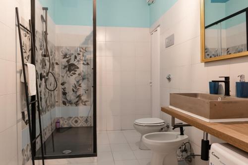 a bathroom with a sink and a toilet and a shower at Saragozza Apartments - Bologna Short Rental in Bologna
