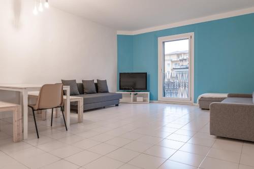 a living room with a couch and a table at Saragozza Apartments - Bologna Short Rental in Bologna