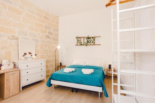Ένα ή περισσότερα κρεβάτια σε δωμάτιο στο ConVivo Apartment Palazzo Galateo
