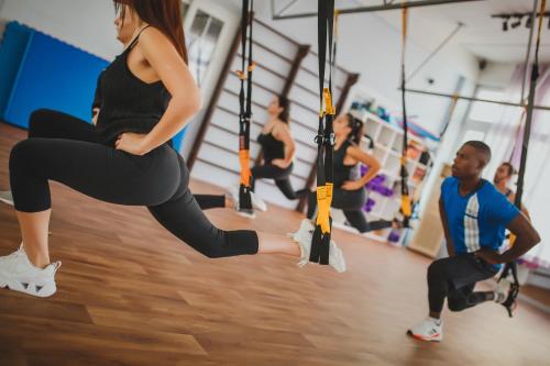 a woman doing a swing in a gym at Luxury Two Bedroom Penthouse in Caesar Resort & SPA, Long Beach in Perivolia tou Trikomou