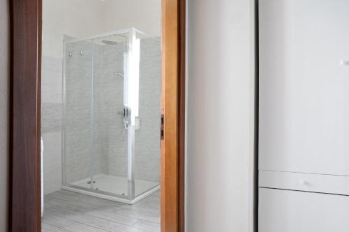 a shower in a bathroom with a glass door at La casa del Pue in Bene Vagienna