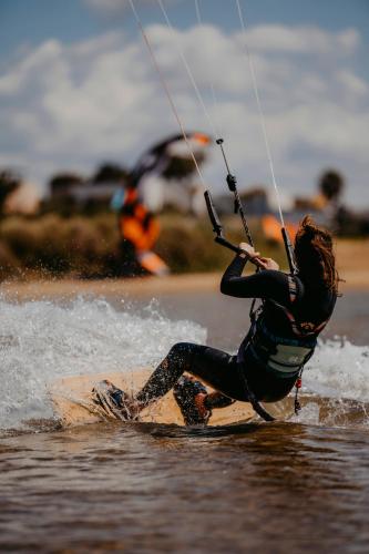 a person on a board in the water at Resort Santa Maria Hotel in Birgi Vecchi
