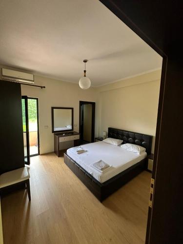 Postel nebo postele na pokoji v ubytování Grand Park Hotel