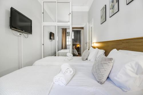 Tempat tidur dalam kamar di Lisboa Charming Apartment II