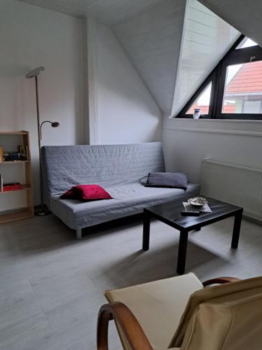 a living room with a couch and a table at Apartment Oase in Balatonszemes
