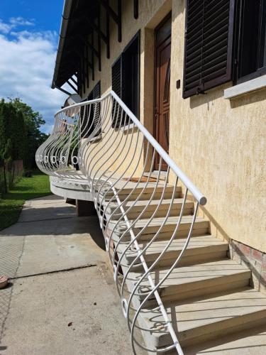 a metal staircase on the side of a building at Apartment Oase in Balatonszemes