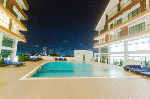 a swimming pool in the middle of a building at Accra Luxury Apartments @ The Signature in Accra