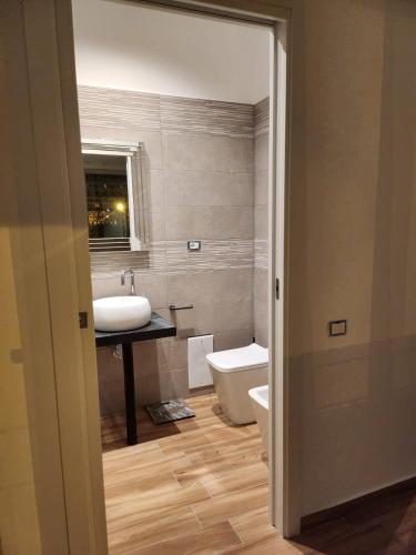 a bathroom with a sink and a toilet at B&B Mini Hotel Incity-close train station and port- in Salerno