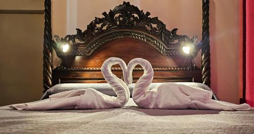 Ένα ή περισσότερα κρεβάτια σε δωμάτιο στο Hostal La Palmera